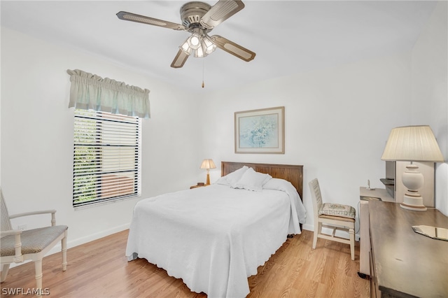 bedroom with light hardwood / wood-style floors and ceiling fan