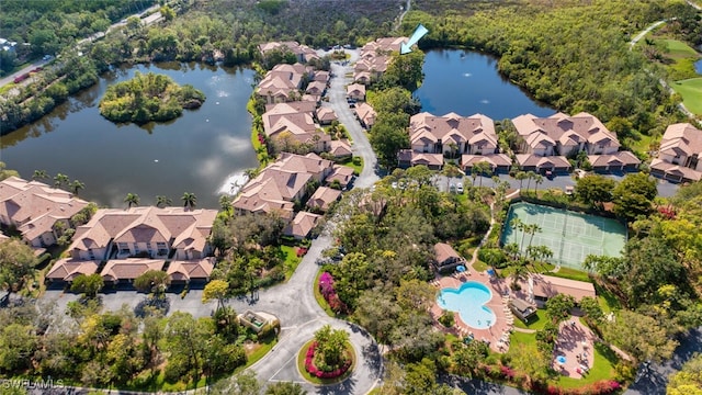 birds eye view of property with a water view