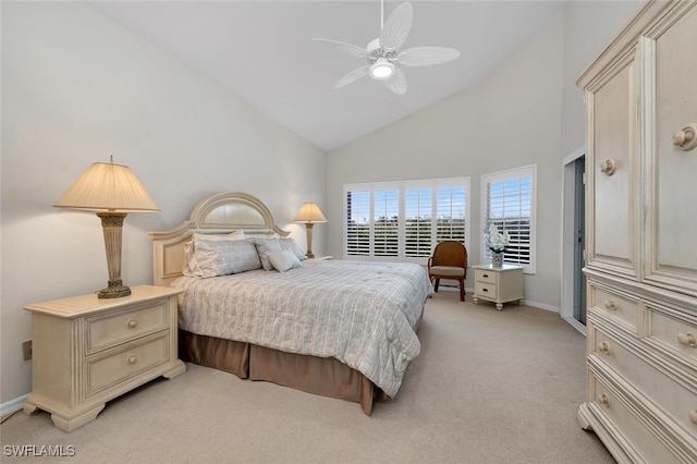 bedroom with baseboards, high vaulted ceiling, light colored carpet, and a ceiling fan