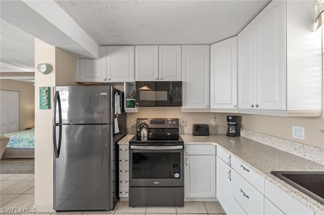 kitchen featuring white cabinetry and appliances with stainless steel finishes