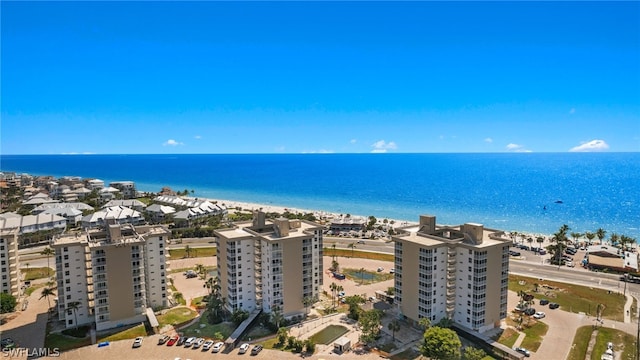 aerial view featuring a water view and a beach view