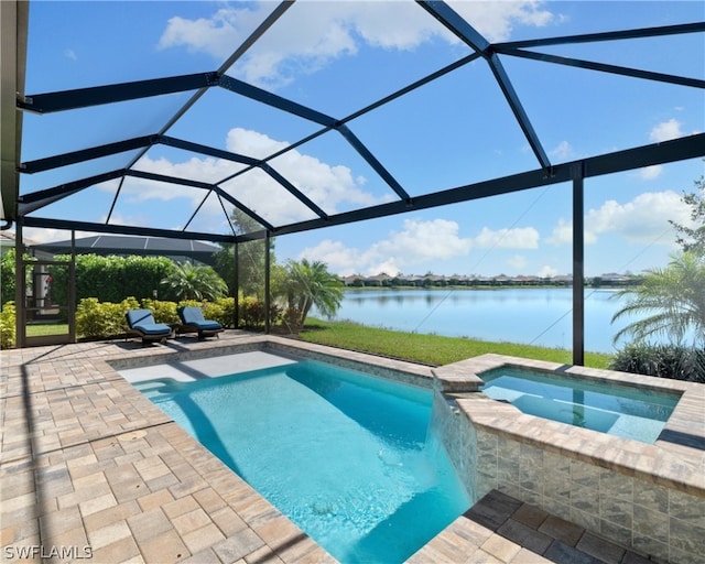 view of pool featuring a patio area, glass enclosure, a water view, and a pool with connected hot tub