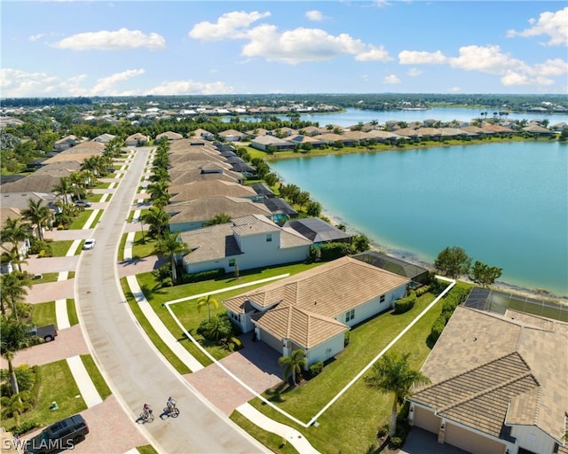 birds eye view of property featuring a residential view and a water view