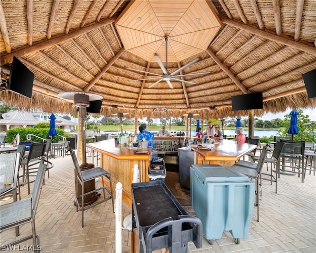 view of patio / terrace featuring a gazebo, exterior bar, and a ceiling fan