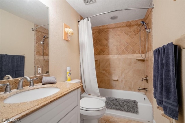 full bathroom featuring tile patterned flooring, shower / bath combination with curtain, a textured ceiling, toilet, and vanity