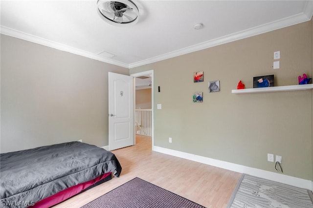 bedroom featuring light hardwood / wood-style floors and ornamental molding