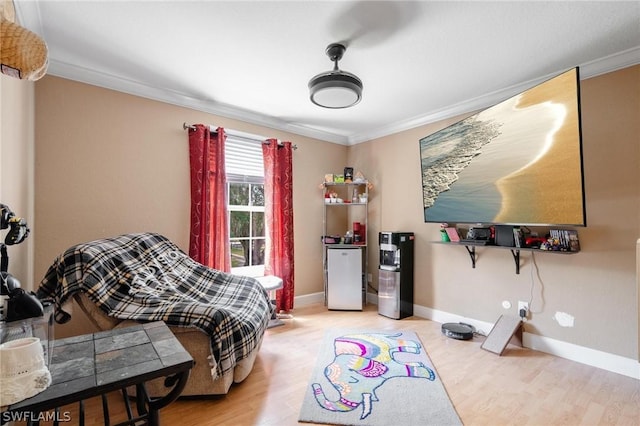 bedroom with white fridge, wood-type flooring, and crown molding