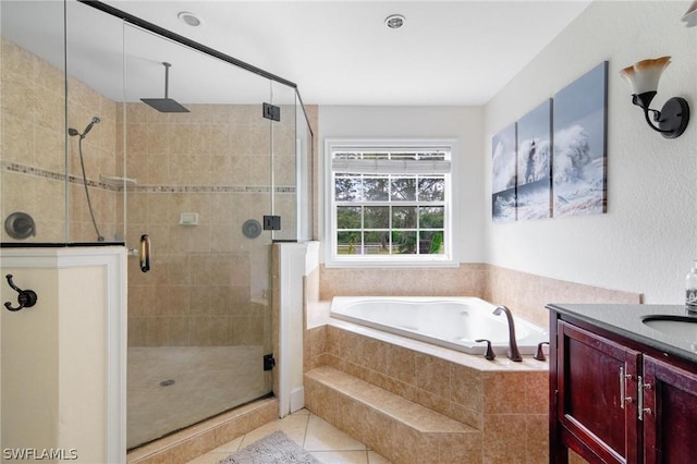 bathroom featuring tile patterned flooring, vanity, and independent shower and bath