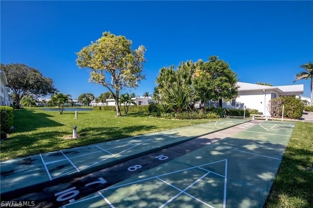 view of home's community featuring a lawn