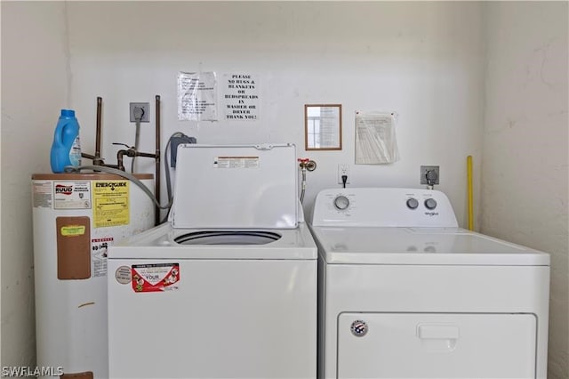 washroom with water heater, washer and dryer, and electric dryer hookup