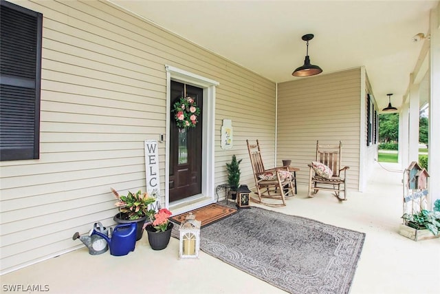 doorway to property featuring a porch