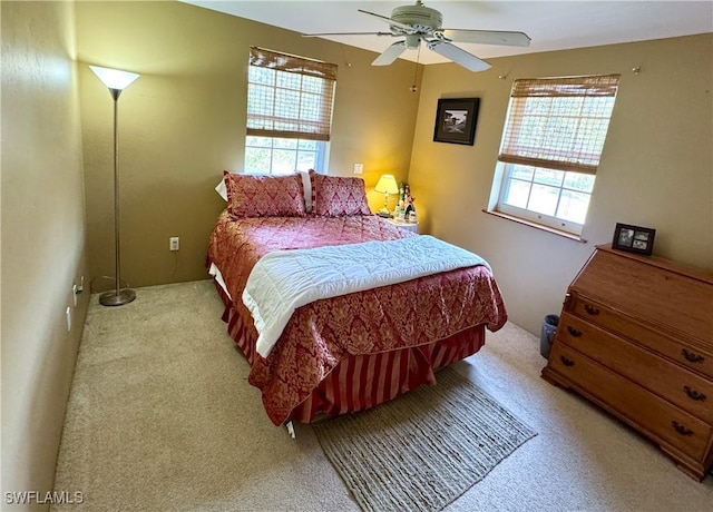 bedroom with light carpet and ceiling fan