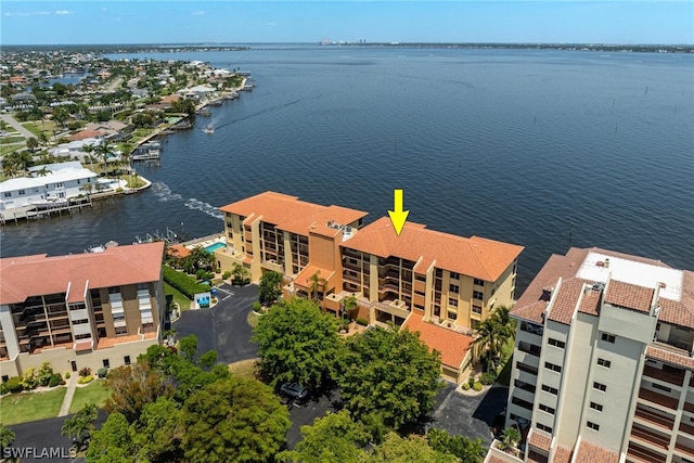 birds eye view of property with a water view