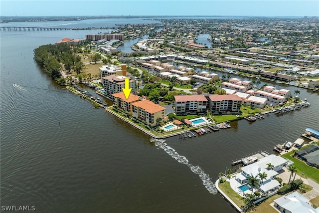 birds eye view of property featuring a water view