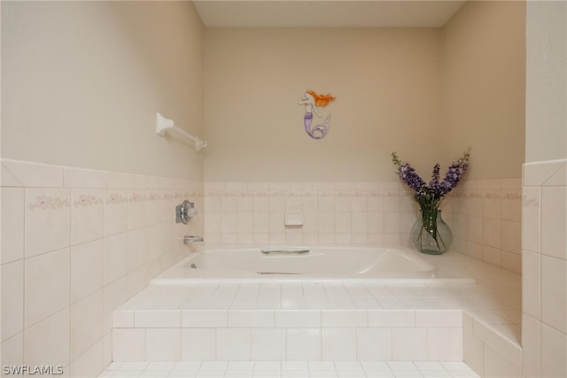 bathroom featuring tiled bath