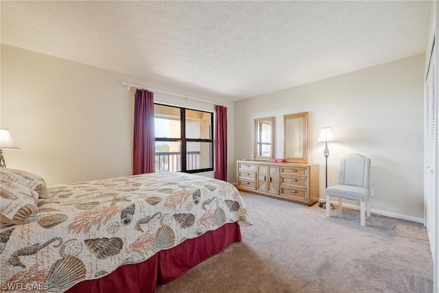 bedroom featuring a closet, carpet flooring, and a textured ceiling