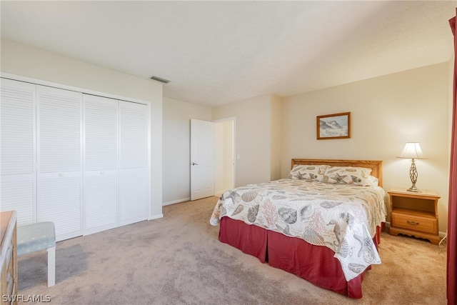 bedroom featuring carpet and a closet