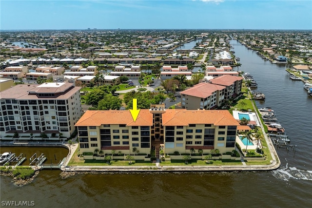 birds eye view of property with a water view