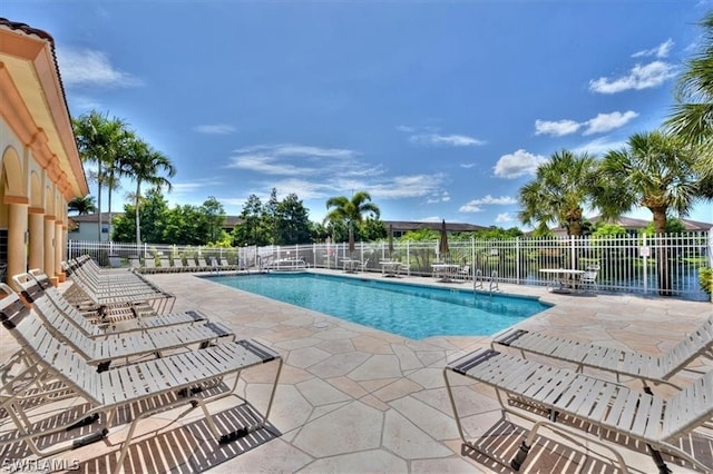 view of swimming pool featuring a patio area