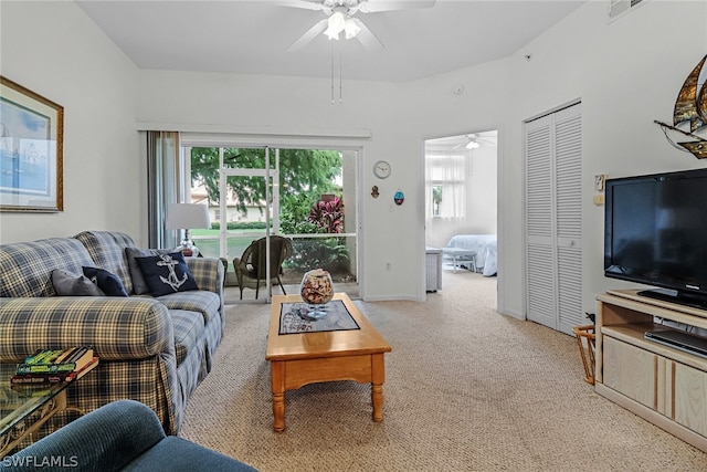 living room featuring ceiling fan and light colored carpet