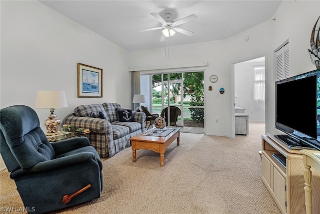 living room featuring ceiling fan and light colored carpet