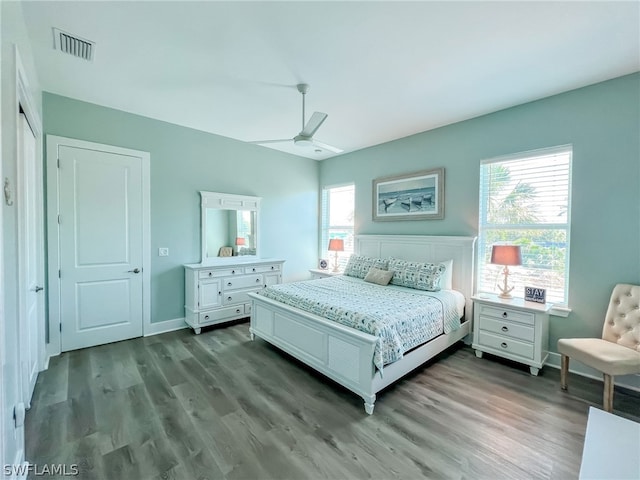 bedroom with ceiling fan and dark hardwood / wood-style floors