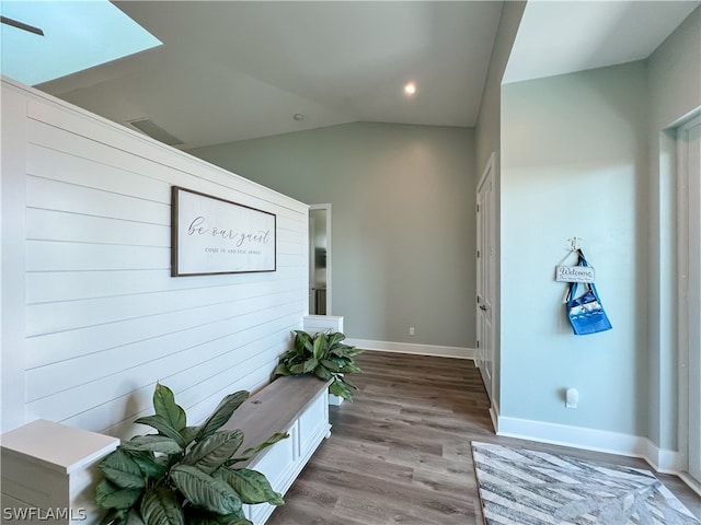 interior space featuring light hardwood / wood-style floors and lofted ceiling