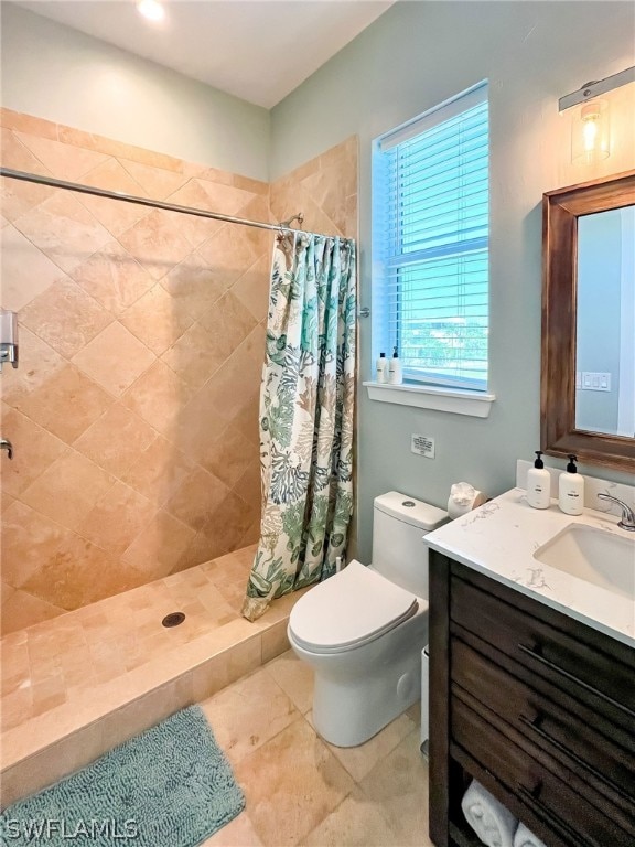 bathroom featuring a shower with curtain, tile flooring, oversized vanity, and toilet