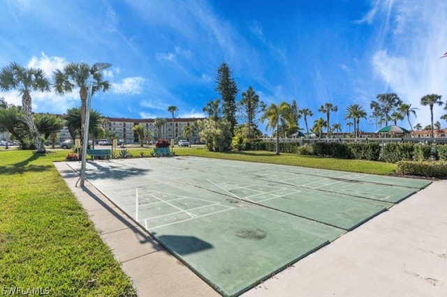 view of home's community featuring a lawn