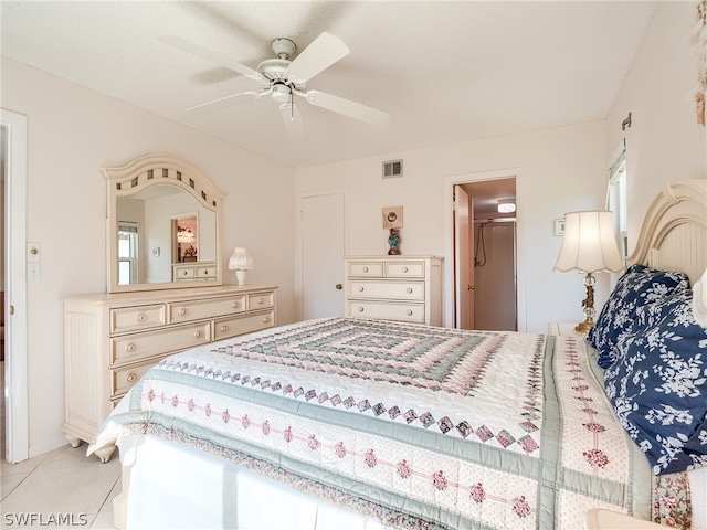 tiled bedroom with ceiling fan