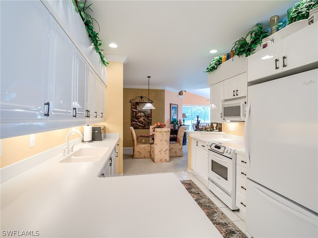 kitchen with hanging light fixtures, white appliances, white cabinets, sink, and ornamental molding