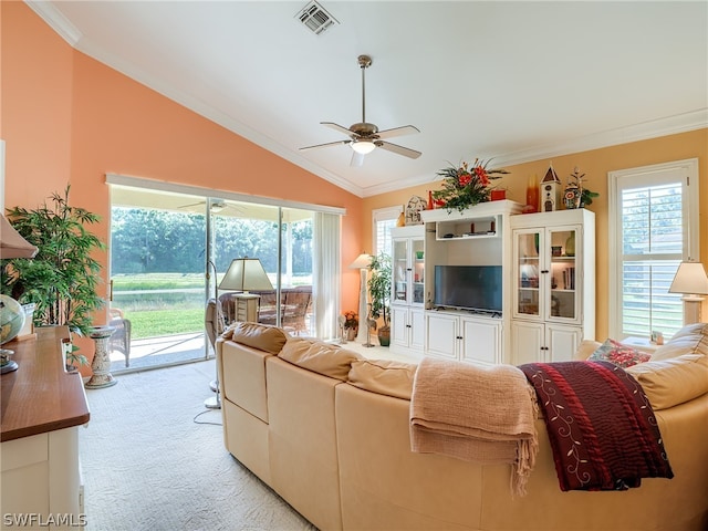 carpeted living room featuring ornamental molding, a healthy amount of sunlight, and ceiling fan