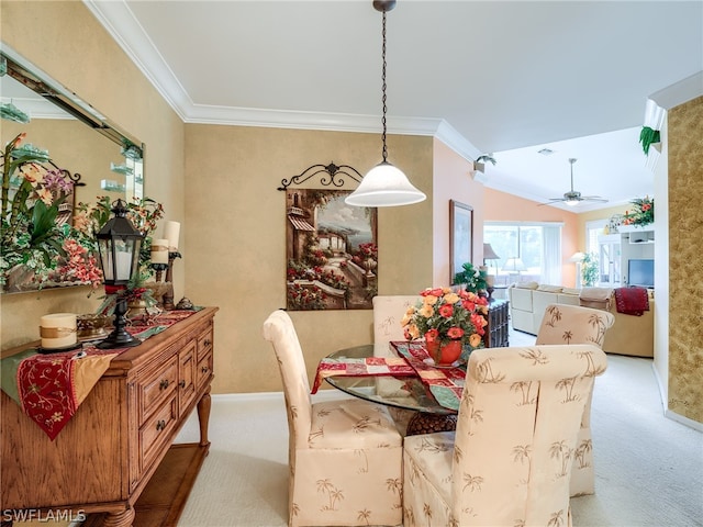 dining area featuring ceiling fan, vaulted ceiling, and light carpet