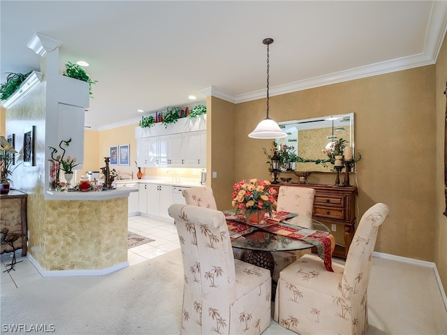 dining room with light carpet and ornamental molding