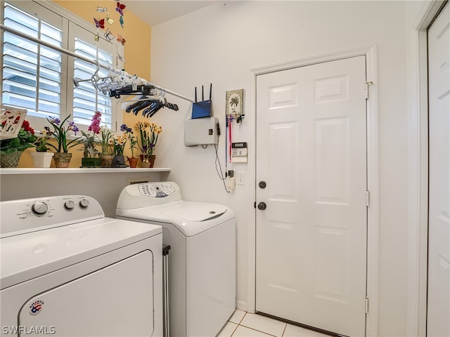 washroom featuring independent washer and dryer and light tile flooring