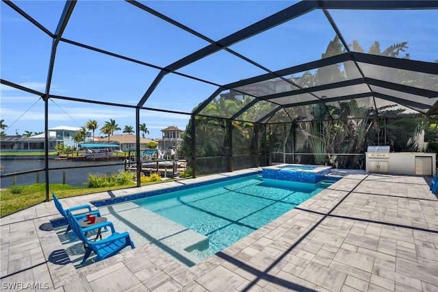 view of pool featuring glass enclosure, exterior kitchen, a grill, a patio area, and an in ground hot tub