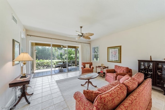 tiled living room with ceiling fan