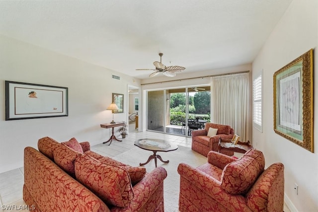 living room featuring ceiling fan and tile flooring