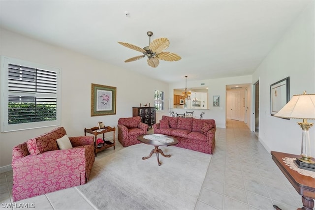 living room with ceiling fan and tile flooring