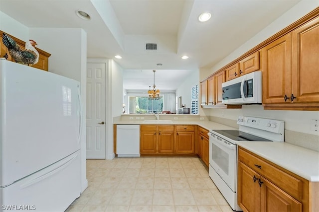 kitchen featuring decorative light fixtures, white appliances, a chandelier, kitchen peninsula, and light tile floors