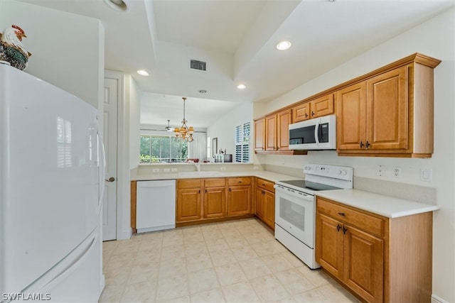 kitchen featuring hanging light fixtures, white appliances, a chandelier, sink, and light tile floors