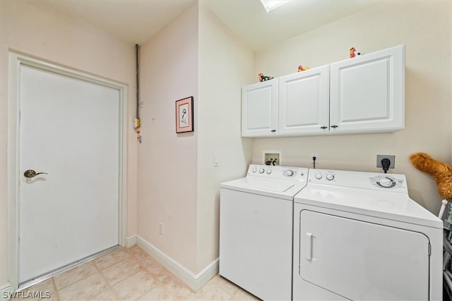 clothes washing area with cabinets, light tile floors, washer and clothes dryer, washer hookup, and hookup for an electric dryer