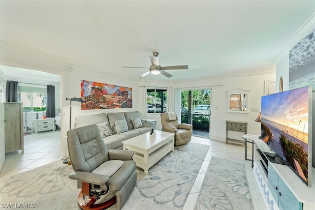 living room featuring ceiling fan, light tile patterned floors, a healthy amount of sunlight, and ornamental molding