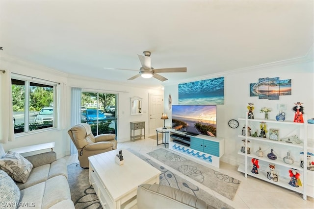 tiled living room with ceiling fan and ornamental molding