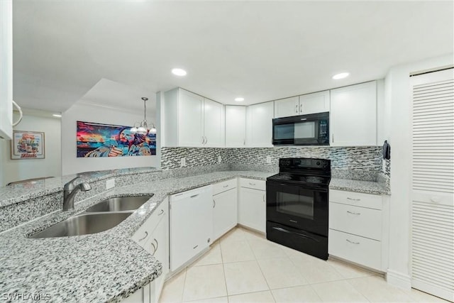 3180 Seasons Way Unit 908, Estero, FL 33928 - kitchen with black appliances, a sink, light stone countertops, white cabinetry, and recessed lighting