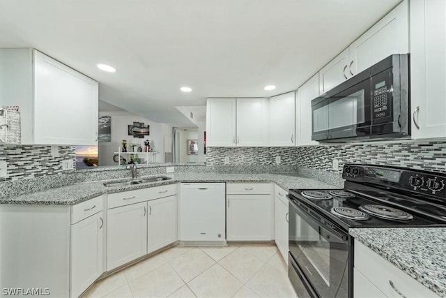 kitchen with white cabinetry, sink, and black appliances