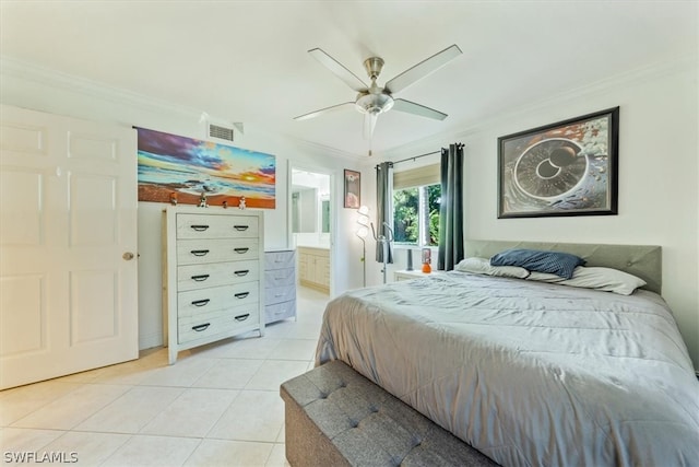 tiled bedroom with ensuite bath, ceiling fan, and crown molding