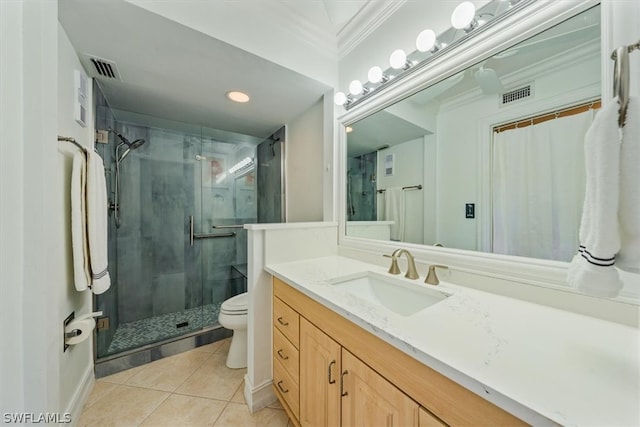 bathroom featuring vanity, tile patterned floors, toilet, ornamental molding, and an enclosed shower