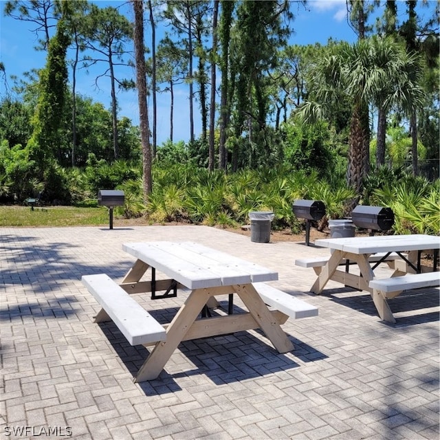 view of home's community with a patio area