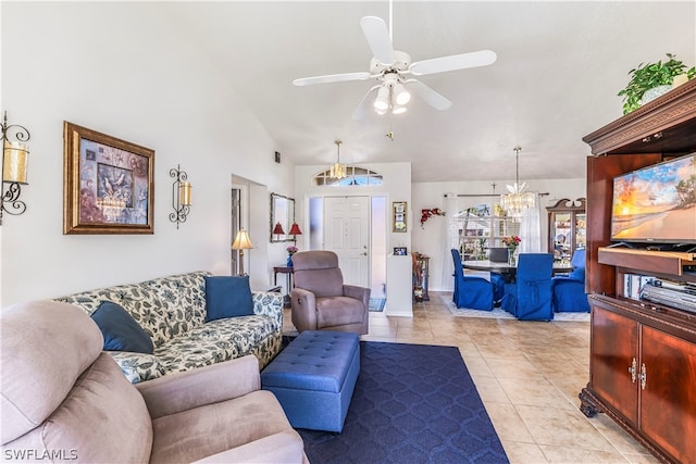 living room featuring ceiling fan with notable chandelier and light tile floors